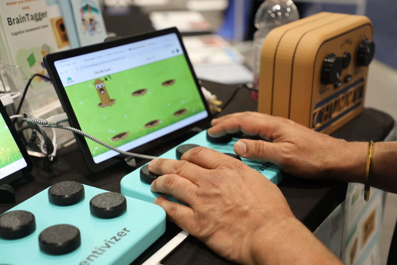 A player reaching for targets on the BrainTagger screen